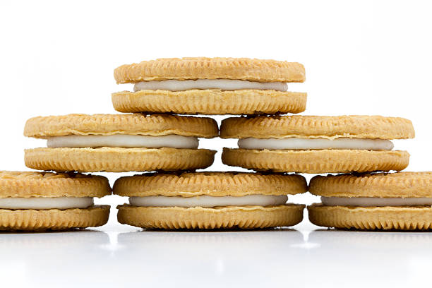 istock Vanilla cookies with cream filling on white background 520221811