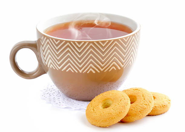 istock Cup of tea with a cookies on a white background 520223758