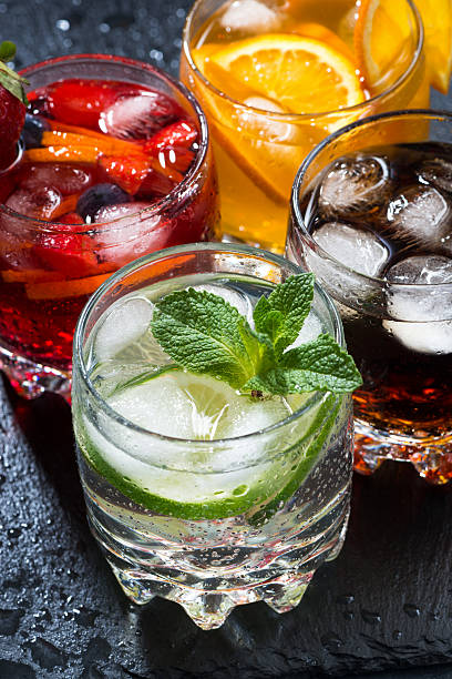 istock iced fruit drinks on a dark background, closeup top view 520223770