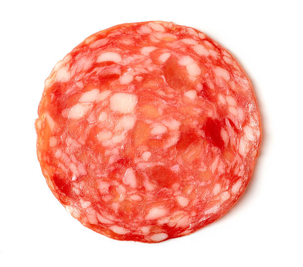istock Sliced summer sausage on white background 520225208
