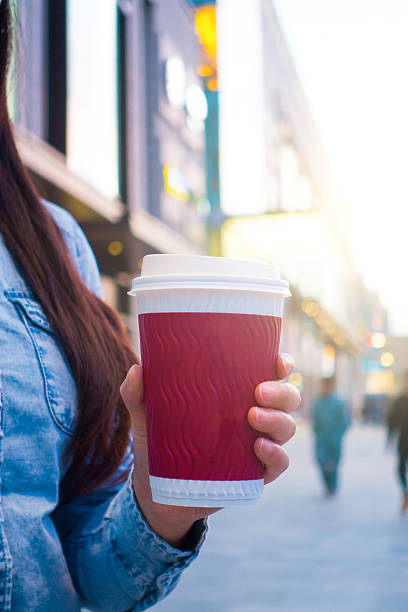 istock Woman hand holding coffee 520225948