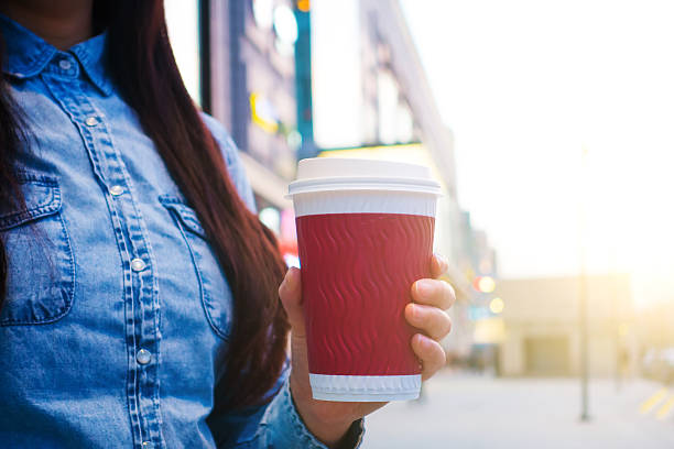 istock Woman hand holding coffee 520226076