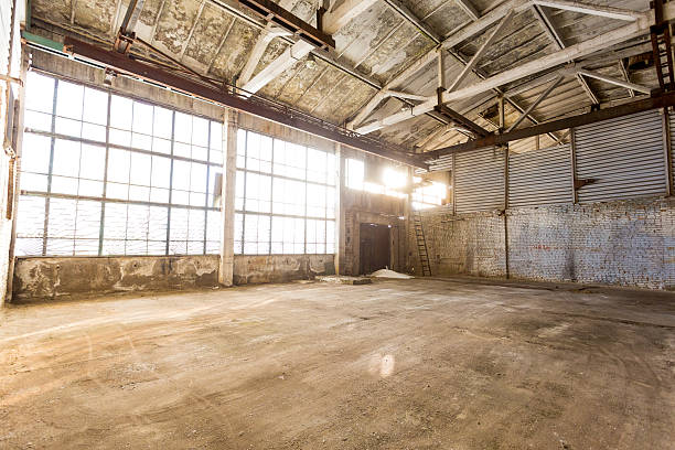 istock abandoned empty room in an old factory 520228056