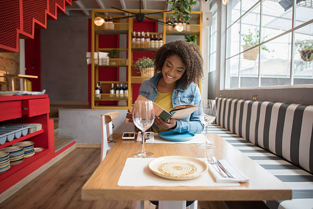 istock Casual woman at a restaurant 520229834