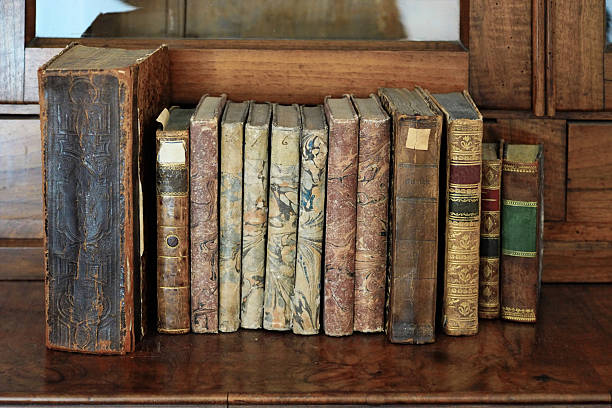 istock Very old books in a row on a book shelf 520229978
