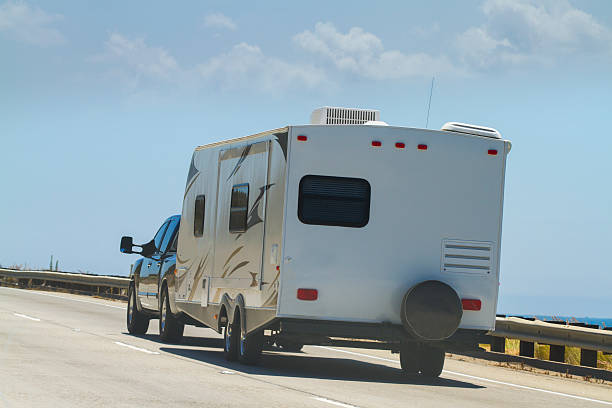 a truck towing a travel trailer