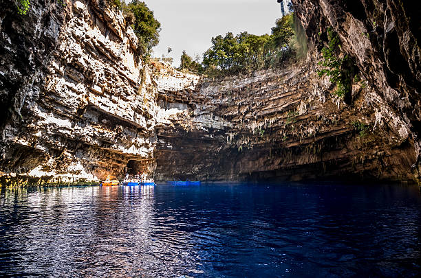 MELISSANI CAVE, KEFALONIA, GREECE - August 9, 2015: Boat with tourists inside the cave.