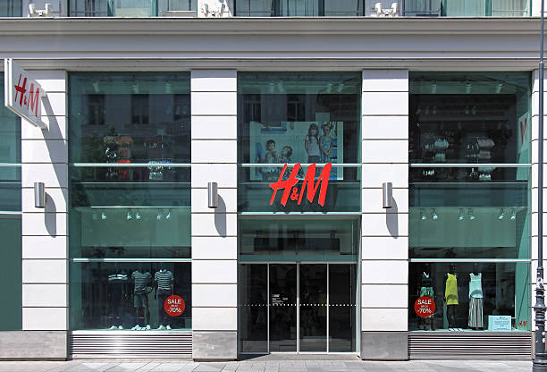 Fashion department store Vienna, Austria - July 12, 2015: H&M department store window on shopping street in Vienna, Austria h and m stock pictures, royalty-free photos & images