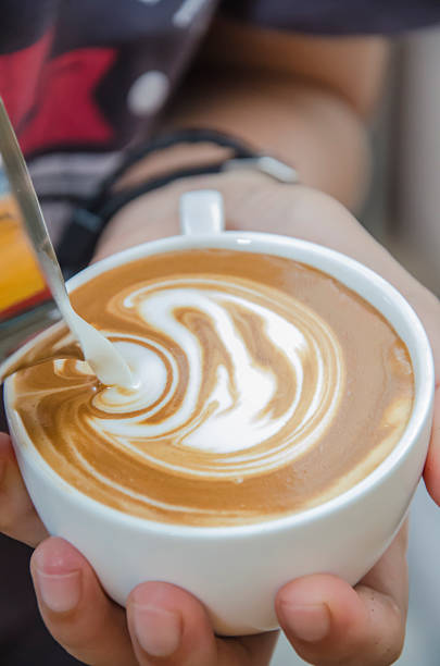 istock Barista making a cup of coffee 520234172