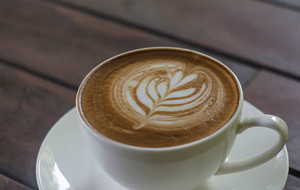 istock Barista making a cup of coffee 520234228