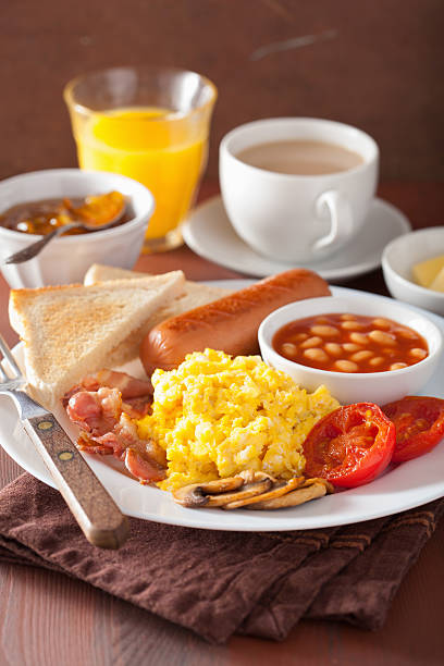 istock full english breakfast with scrambled eggs, bacon, sausage, bean 520235492