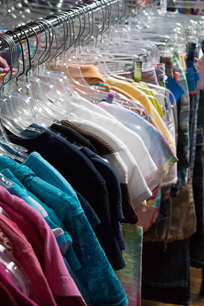 istock Clothing hanging on a rack in a store 520236912