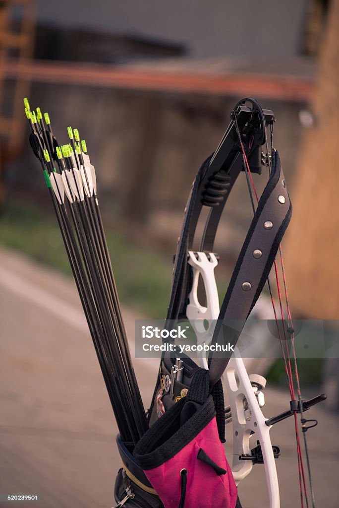 Woman with the bow Selective focus on the bag with many arrows Activity Stock Photo