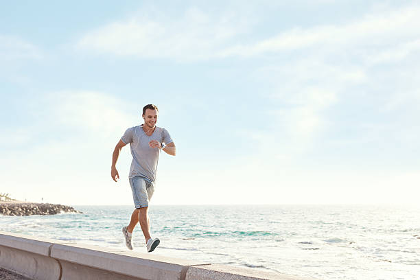 istock young man walking with earphones 520239915