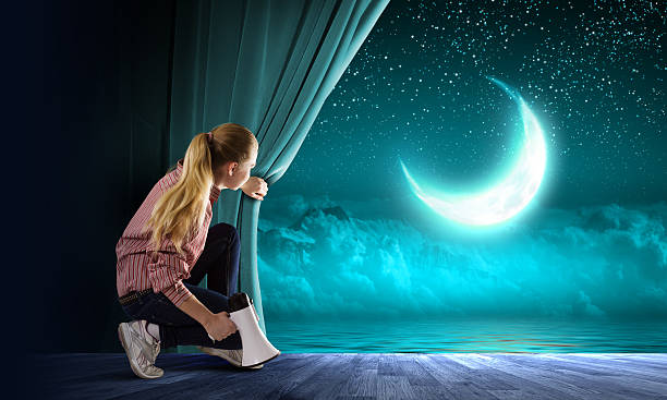 istock Girl opening curtain 520240069
