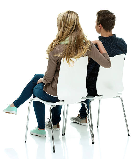 istock Rear view of couple on chair looking away 520242557