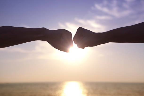 istock Sunset and two arms stretched out 520243165