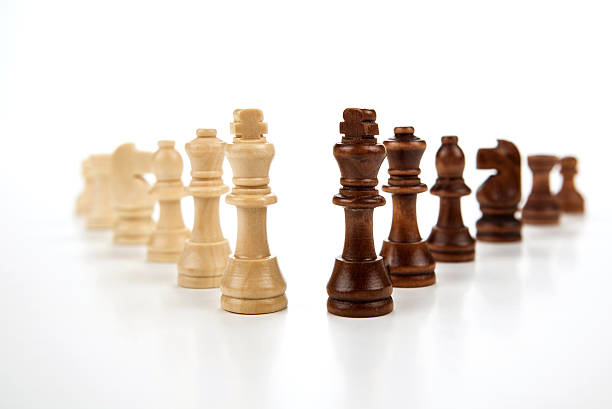 istock chess pieces lined up in a row on a gray 520243469
