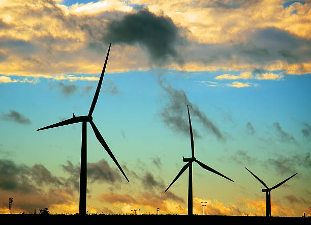 istock Black silhouettes of wind turbines 520243611