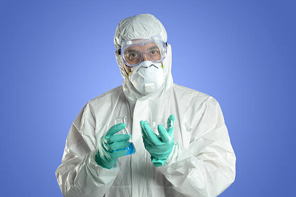 istock Researcher with protective hazmat suit 520243757