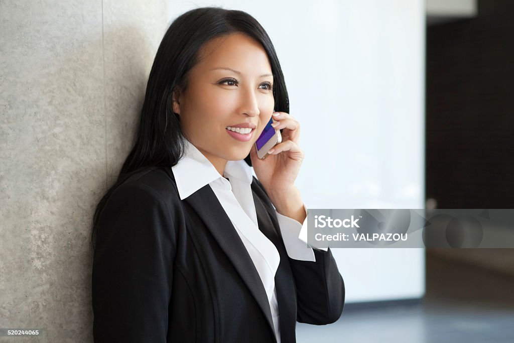 Asian Businesswoman Communicate With Her Cellphone Adult Stock Photo