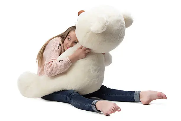 Photo of Image of girl hugging teddy bear