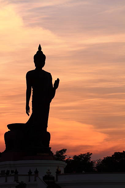 istock Buddha statue at sunset in the evening. 520258811