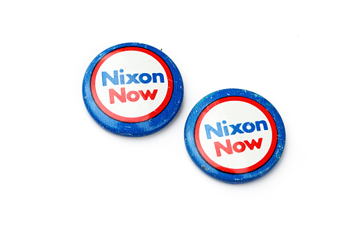 West Palm Beach, USA - October 22, 2014: Vintage Richard Nixon political campaign buttons. Richard Nixon was the 37th President of the United States and the only president to resign the office.