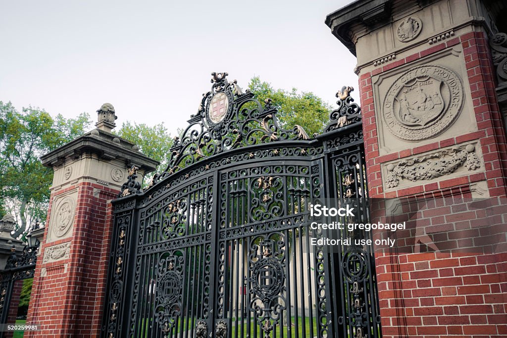 Gate at entrance to Brown University in Providence, Rhode Island Providence, United States - August 9, 2014: A closed gate is seen outside the entrance to the Front Green on the campus of Brown University along Prospect Street. Brown University, a private Ivy League university that was founded in 1764, is the 7th oldest institution of higher learning in the United States and currently has over 8,000 enrolled students. Brown University Stock Photo