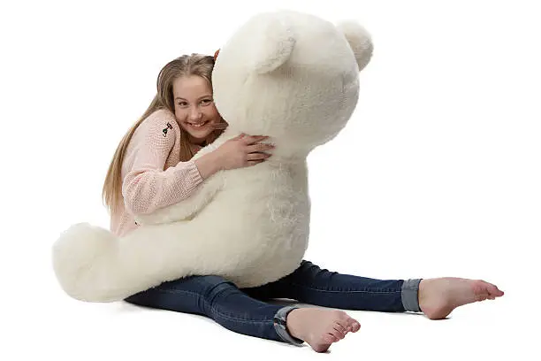 Photo of Portrait of girl hugging teddy bear