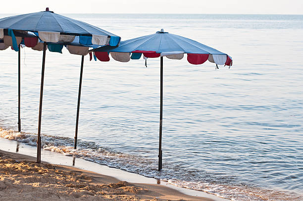 istock Umbrella on the beach in the evening 520260733