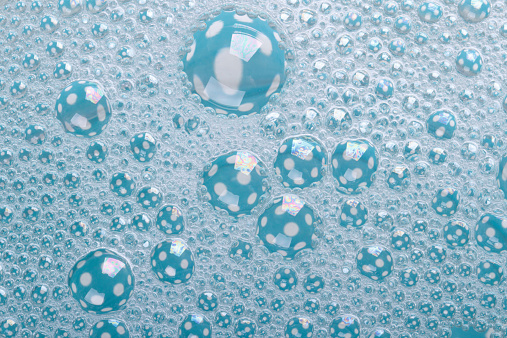 soap bubbles in polka dot closeup background. texture. macro