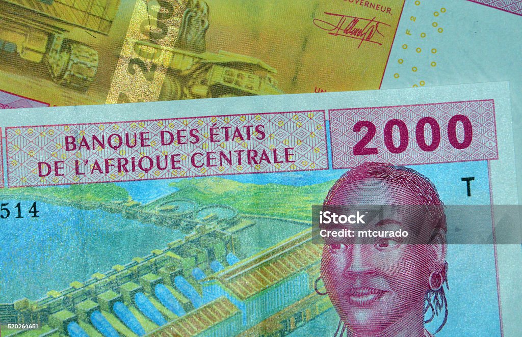 Central African CFA Francs (XAF currency code) Brazzaville, Congo: partial view of Central African CFA Franc bank notes issued by the BEAC (Banque des États de l'Afrique Centrale, Bank of the Central African States) - currency of the Economic and Monetary Community of Central Africa (Cameroon, Central African Republic, Chad, Republic of the Congo, Equatorial Guinea and Gabon) - 2000 Francs obverse and reverse - woman and mining truck-  photo by M.Torres Currency Stock Photo