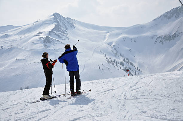 Directions on the signpost to the ski resort and the ski lift.