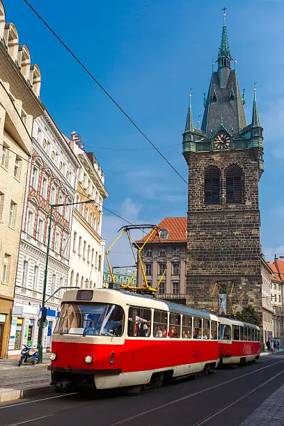 Photo of Red retro tram near Jindrisska Tower in Prague, Czech