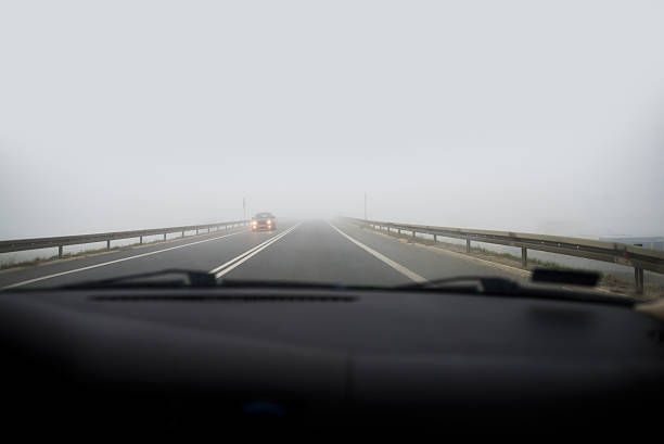 istock Car driving in thick fog 520278565