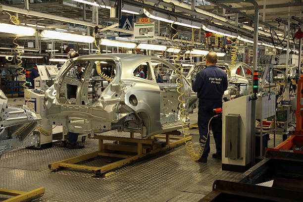 Tychy, Poland - June, 16th, 2011: Cars production line in Fiat factory in Poland. The Assembly Plant ensures both the production of the Fiat range models (Panda II, 500), Lancia/Chrysler Ypsilon and Ford Ka. The manufacturing line was adapted for an annual capacity of 600,000 cars.