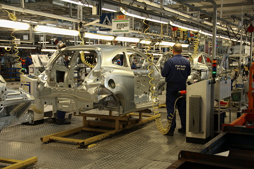 Tychy, Poland - June, 16th, 2011: Cars production line in Fiat factory in Poland. The Assembly Plant ensures both the production of the Fiat range models (Panda II, 500), Lancia/Chrysler Ypsilon and Ford Ka. The manufacturing line was adapted for an annual capacity of 600,000 cars.