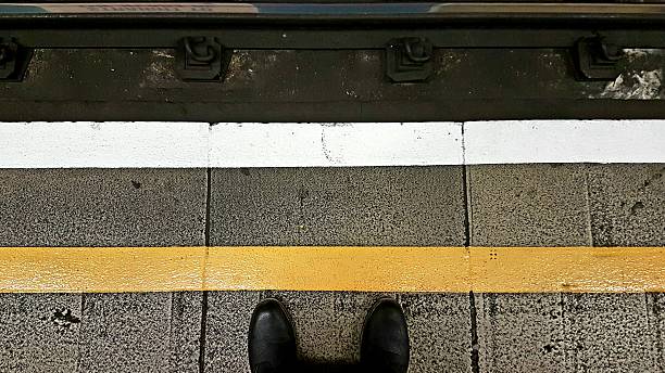 Stand Behind The Yellow Line stock photo