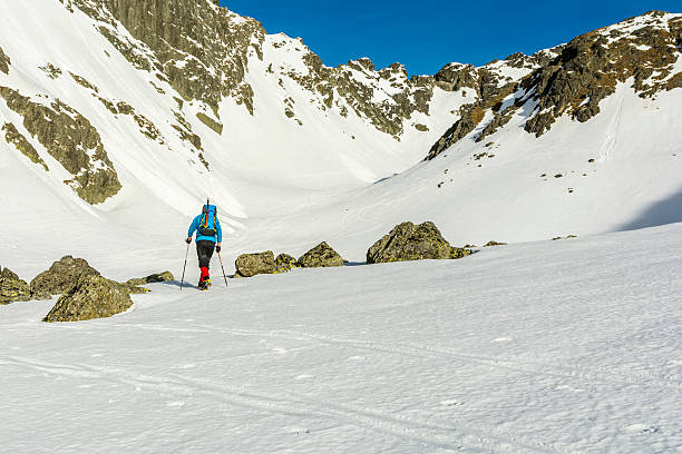 istock Mountaineer goes into the valley. 520283880