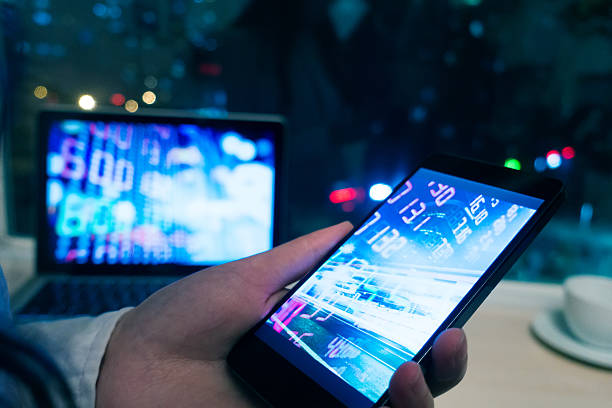istock Smartphone and laptop with stock market graph 520283990