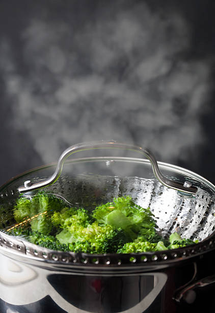 istock Freshly steamed green broccoli in skimmer pot 520285206