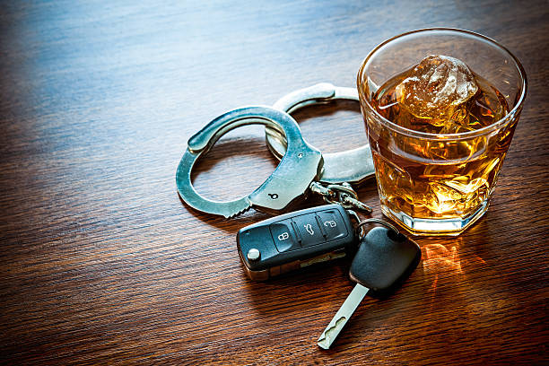 dont drink and drive Whiskey with car keys and handcuffs concept for drinking and driving cognac brandy photos stock pictures, royalty-free photos & images