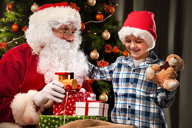 istock Santa Claus and a little boy 520286792