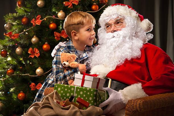 istock Santa Claus and a little boy 520286870