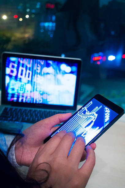 istock Smartphone and laptop with stock market graph 520287176