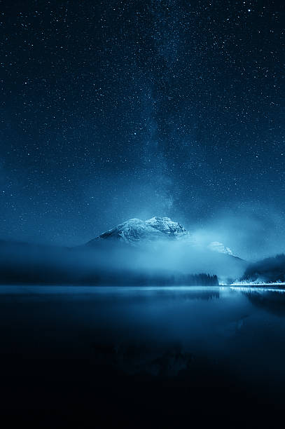 Milky way mountain lake Snow mountain with fog over lake with milky way yoho national park photos stock pictures, royalty-free photos & images