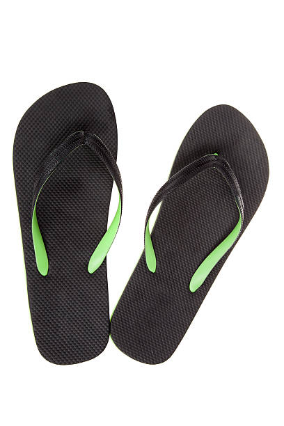 istock Black thongs, isolated on white. Beach Sandals, flip flops 520290892