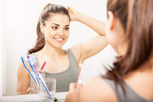 istock Pretty girl shaving her armpit 520292630