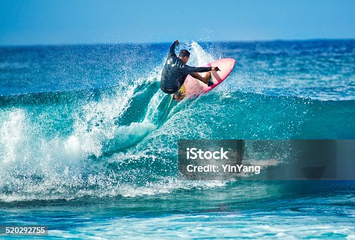 istock Surfing in the Beach of Kauai Hawaii Horizontal 520292755